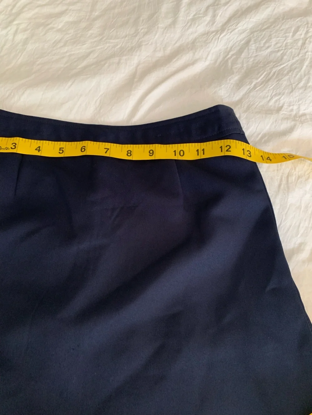 Navy Pleated Mini Skirt with Side Buckle Detail